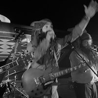 black and white photo of a group of people on stage